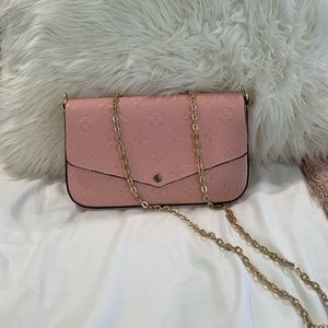 Louis Vuitton pink cross body bag *not authentic*